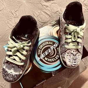 Healy’s roller tennis shoes.  Worn once and in Brand New Condition Size4